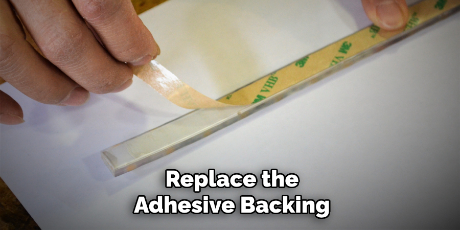 Replace the
Adhesive Backing