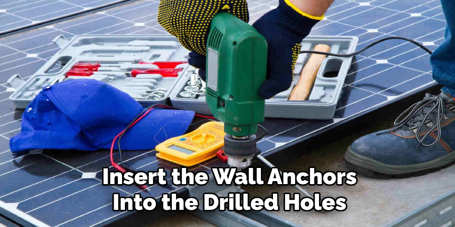 Insert the Wall Anchors Into the Drilled Holes