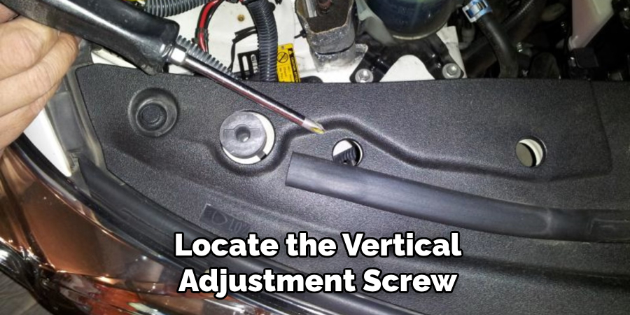 Locate the Vertical
Adjustment Screw