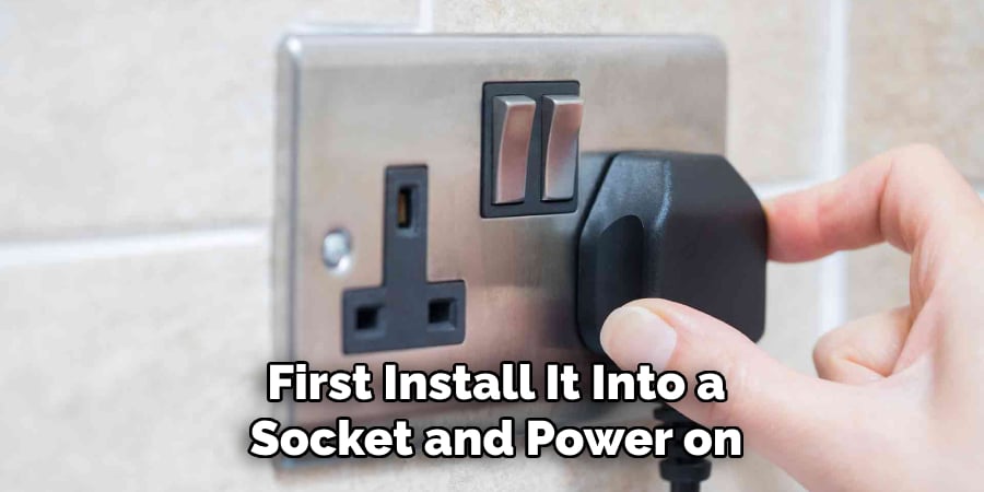 First Install It Into a
Socket and Power on