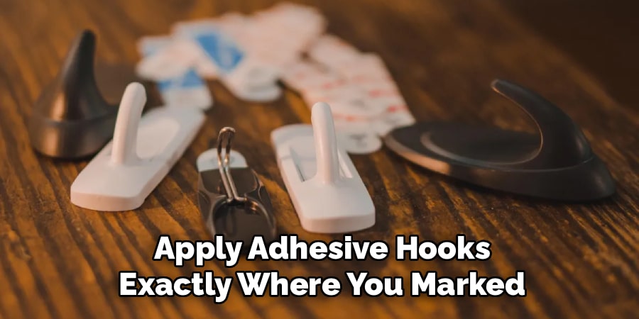 Apply Adhesive Hooks
Exactly Where You Marked
